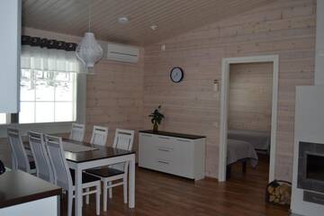 Фото номера Коттедж Делюкс с двумя спальнями Курортные отели Ruoke Holiday Village г. Кесялахти 49