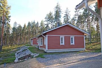 Фото номера Коттедж Делюкс с двумя спальнями Курортные отели Ruoke Holiday Village г. Кесялахти 32