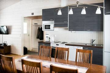 Фото номера Коттедж Делюкс с двумя спальнями Курортные отели Ruoke Holiday Village г. Кесялахти 27