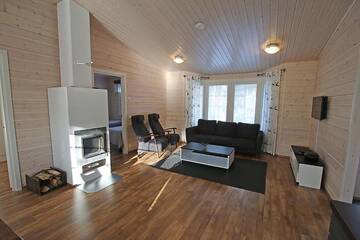Фото номера Коттедж Делюкс с двумя спальнями Курортные отели Ruoke Holiday Village г. Кесялахти 41