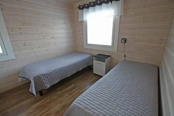 Фото номера Коттедж Делюкс с двумя спальнями Курортные отели Ruoke Holiday Village г. Кесялахти 39