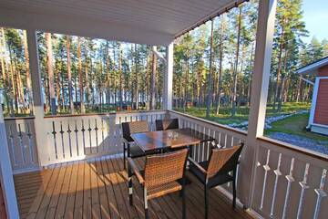 Фото номера Коттедж Делюкс с двумя спальнями Курортные отели Ruoke Holiday Village г. Кесялахти 35