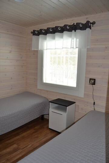 Фото номера Коттедж Делюкс с двумя спальнями Курортные отели Ruoke Holiday Village г. Кесялахти 13
